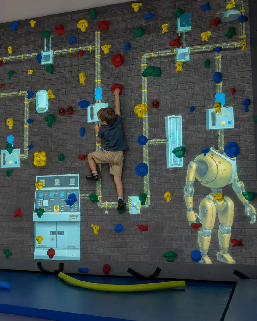Kid on interactive wall