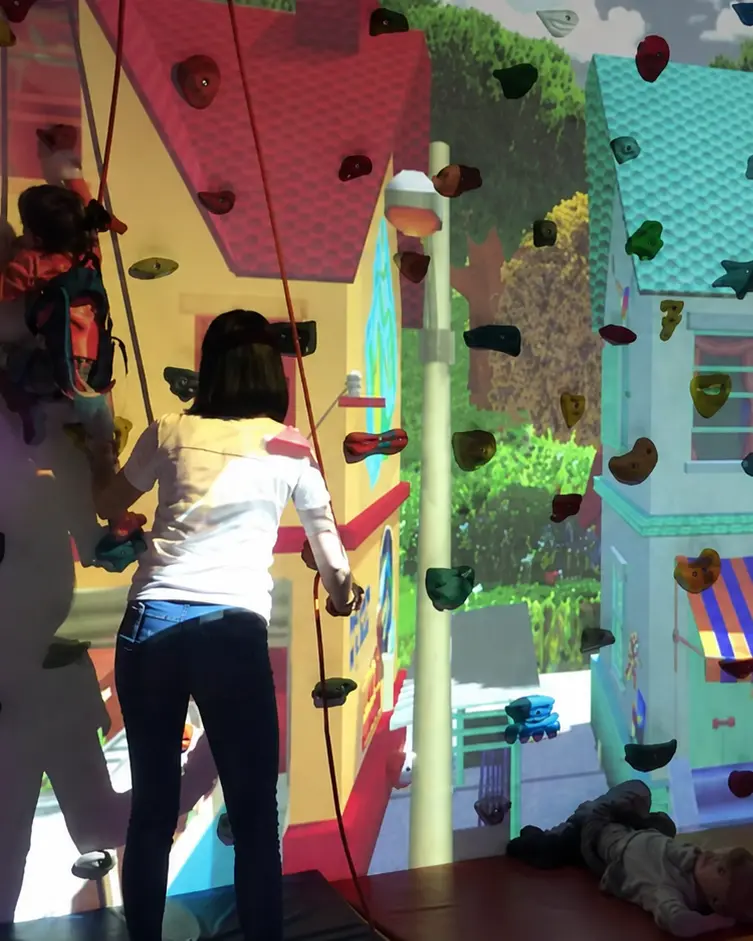 Child using sensory climbing wall