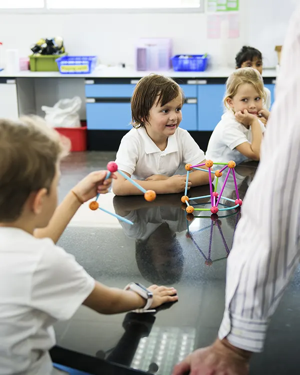 Children building a molecular model in class