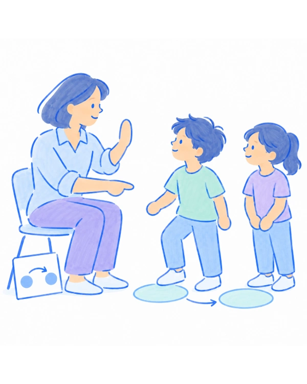 An educator demonstrating a turn-taking signal to two children beside projected floor targets